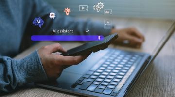 Person using AI on laptop and phone, implying use of AI to write continuous assessment
